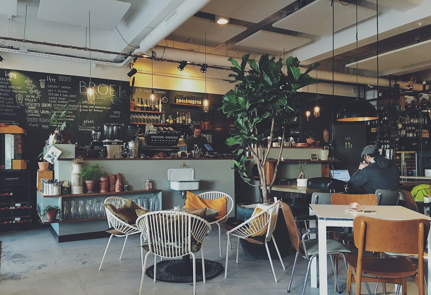 A kopitiam counter at Yew Tee in the early morning, fluorescent light and empty stools